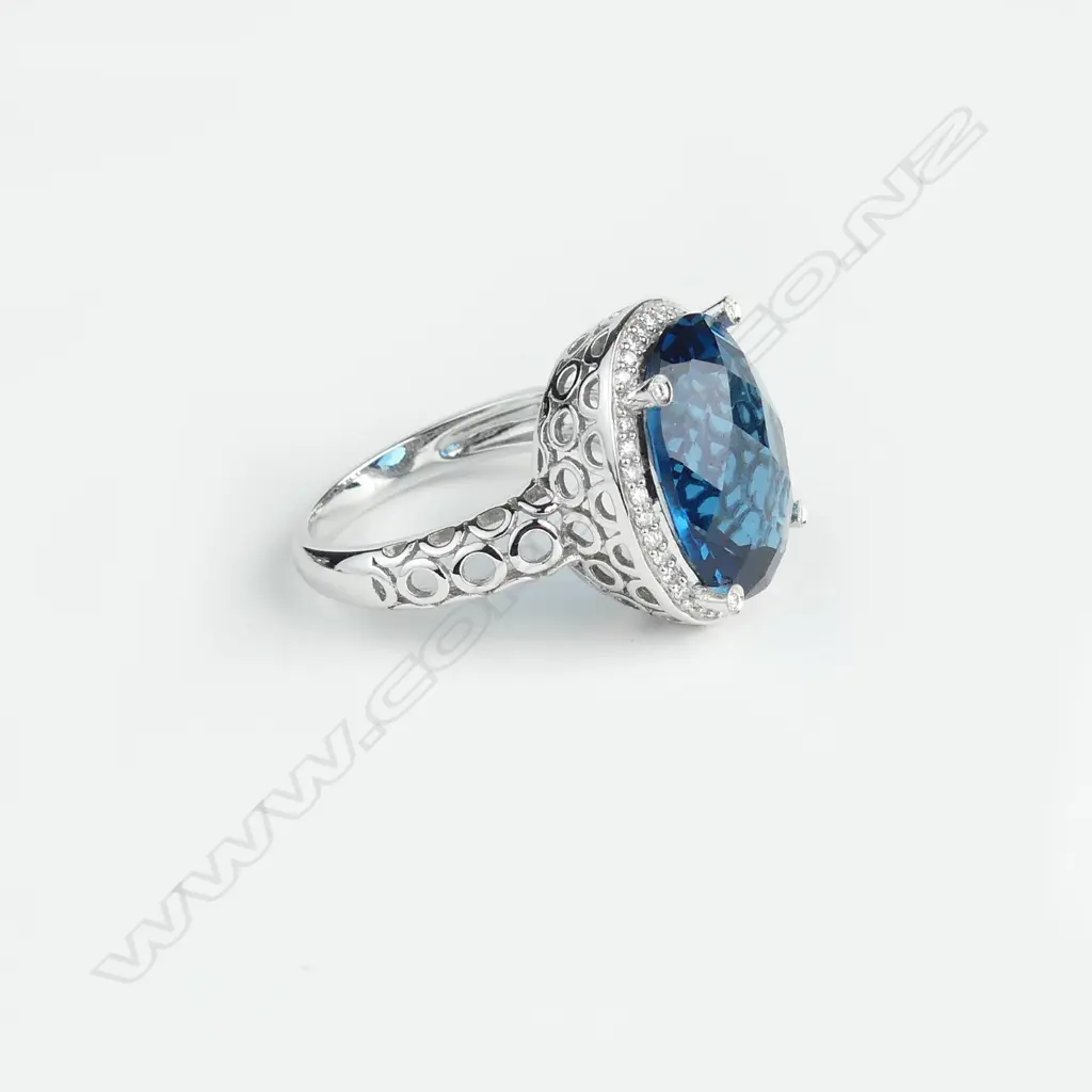 A 9ct white gold blue topaz and diamond ring Image 1++