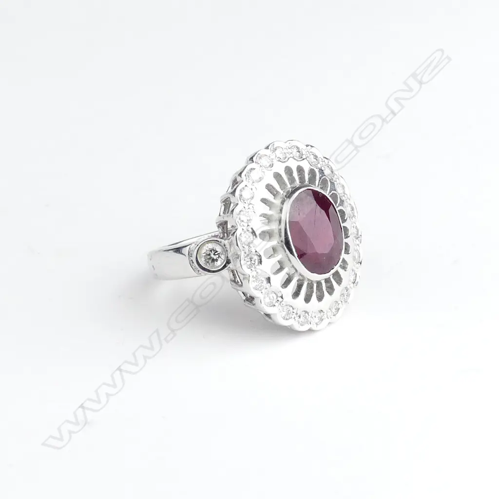An 18ct white gold ruby and diamond ring Image 1++