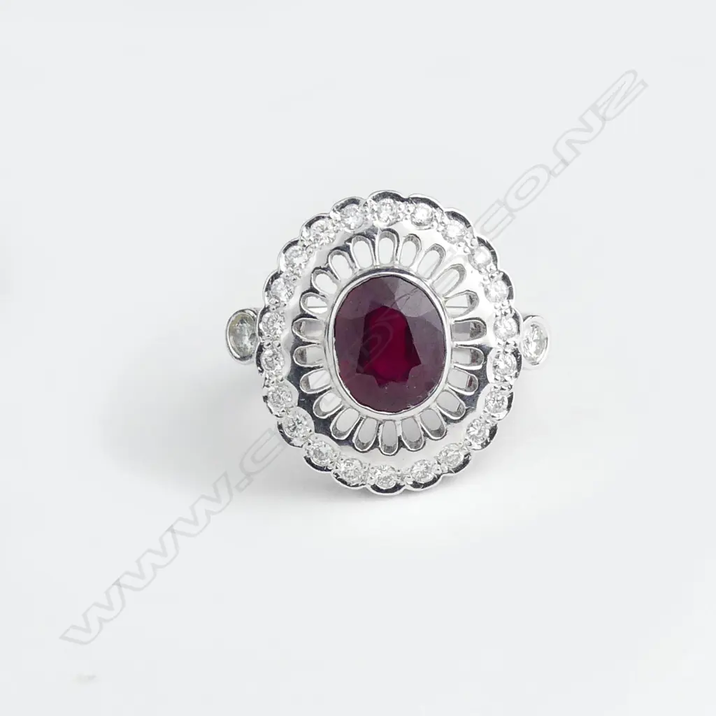 An 18ct white gold ruby and diamond ring Image 1++