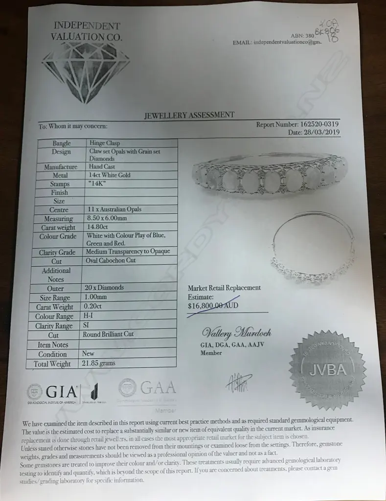 A 14ct white gold opal and diamond bangle Image 1++
