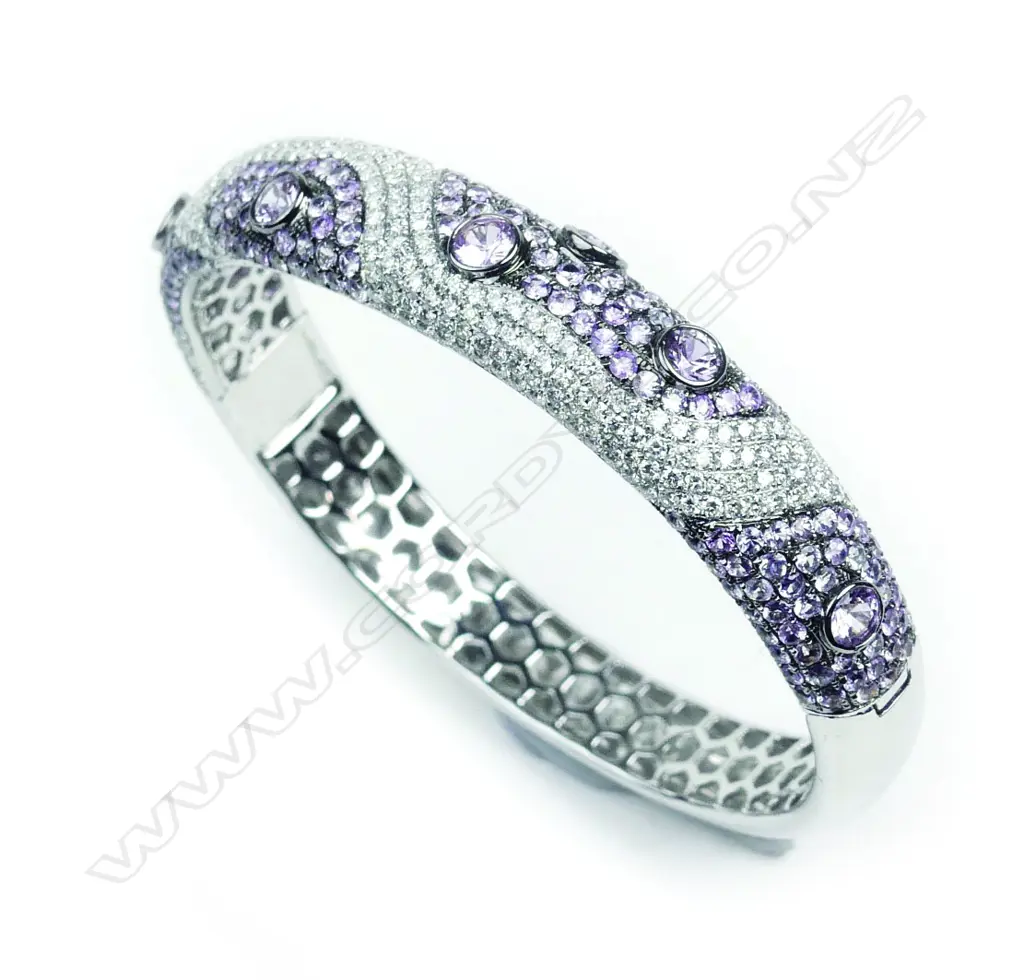 An encrusted 18ct white gold diamond and pink sapphire hinged bangle Image 1++