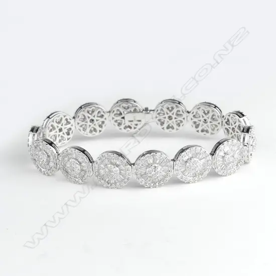 A lady's modern 18ct. white gold multi-cluster diamond bracelet