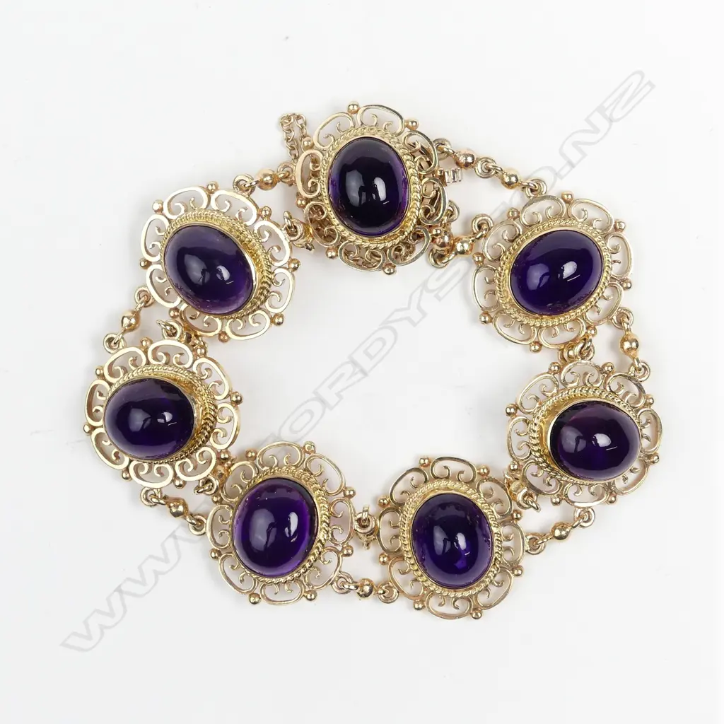 A mid-20thC lady's 9ct. rose gold and amethyst panelled bracelet Image 1++