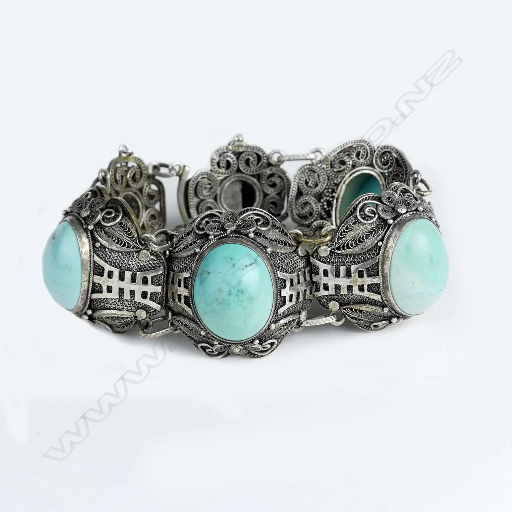A mid-20thC Chinese filigree silver and turquoise cabochon bracelet Image 1++