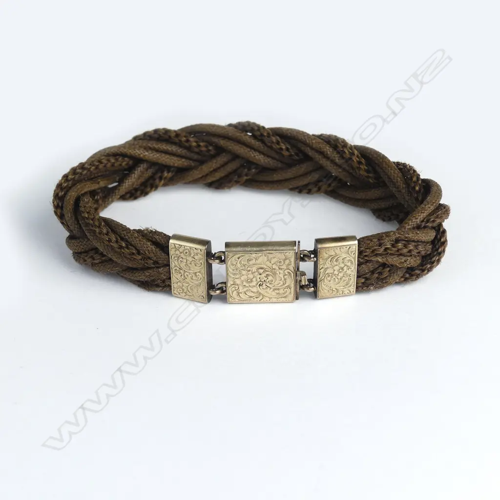 A Victorian fine plaited hair and 10ct. yellow gold mounted bracelet Image 1++