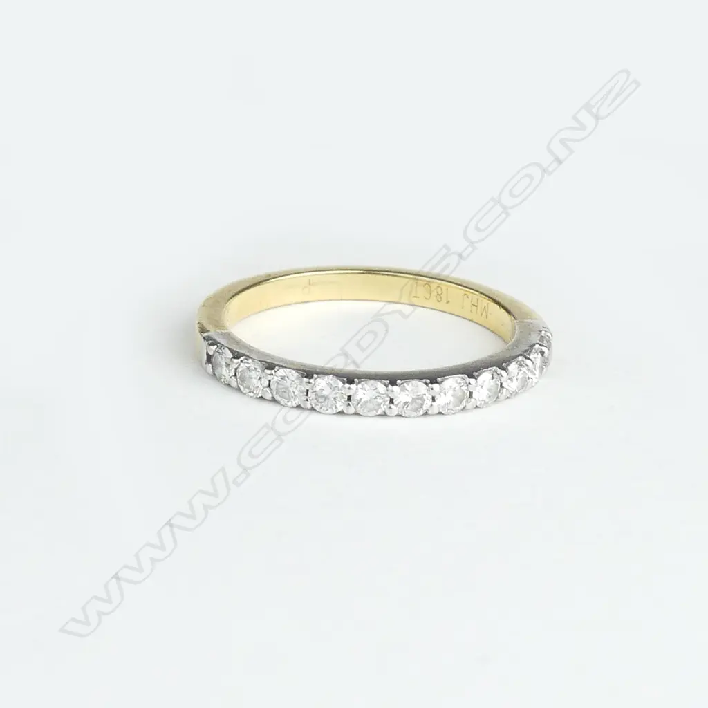 A lady's estate 18ct. yellow gold and eleven diamond band ring Image 1++