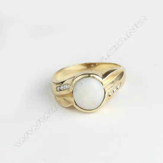 A 9ct gold opal and diamond ring