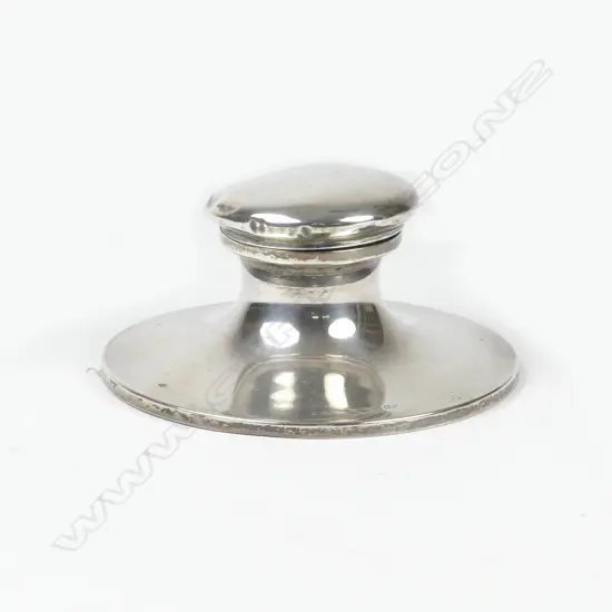 An early 1900s silver inkwell