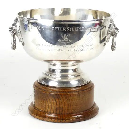 A heavy silver trophy rose bowl