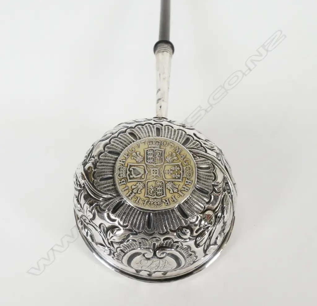 An 18thC silver toddy ladle Image 1++