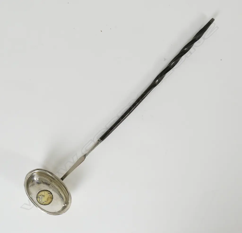 An 18thC embossed silver toddy ladle Image 1++