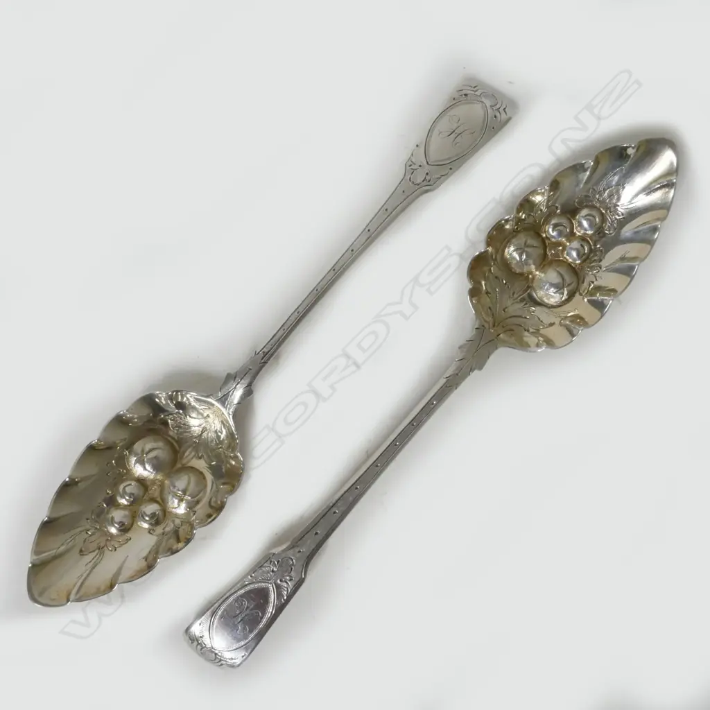 A pair of George III silver berry spoons Image 1++