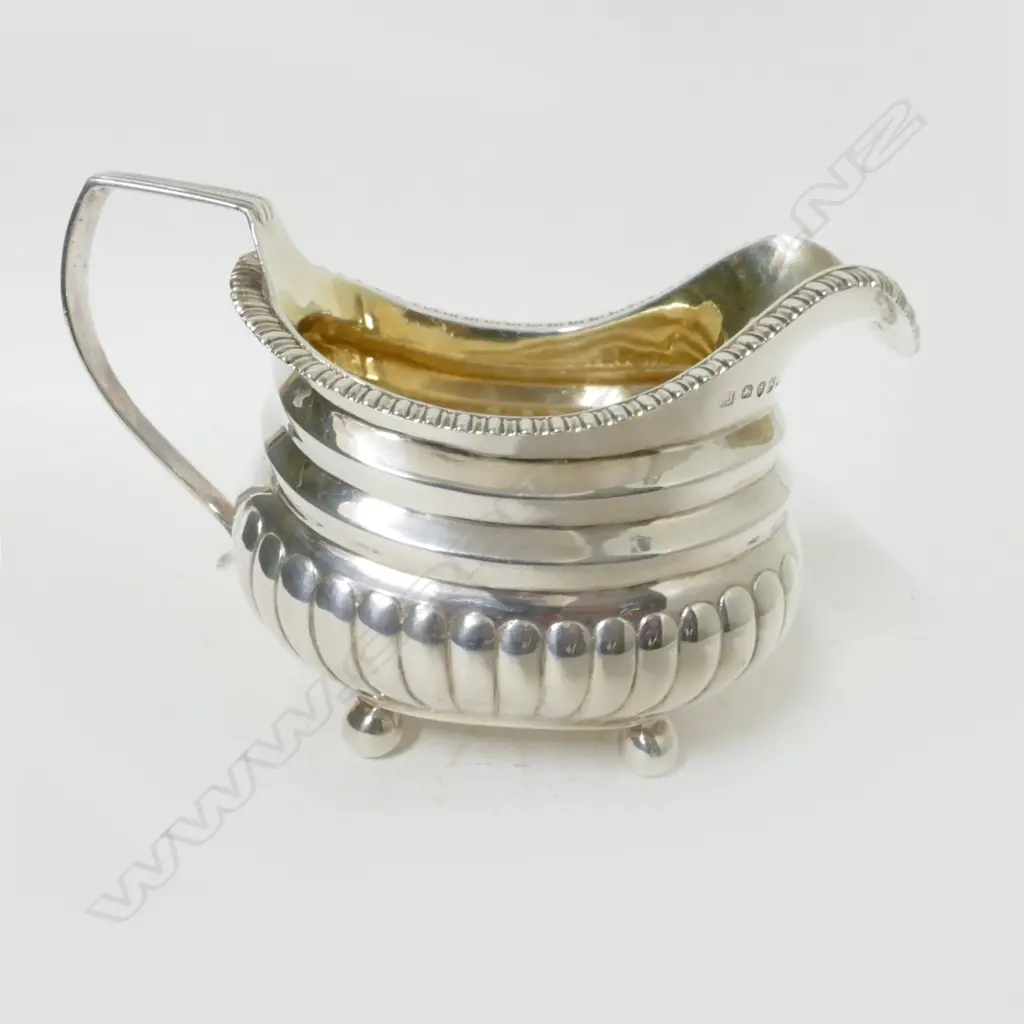 A George III silver milk jug Image 1++