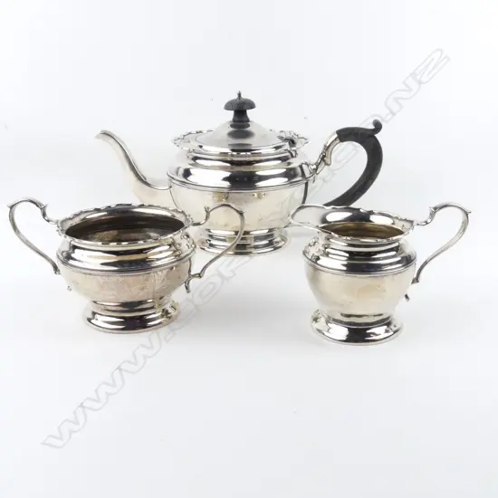 A three piece silver tea set