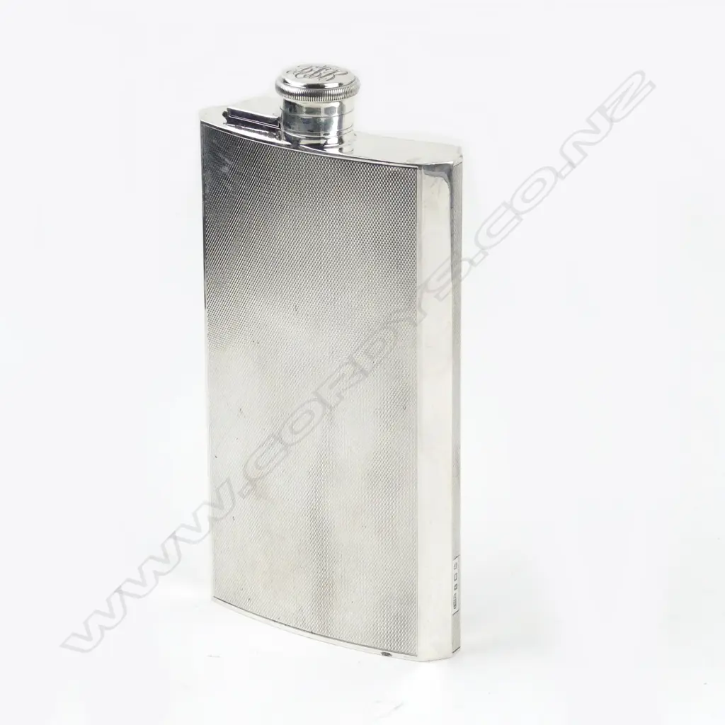 A silver pocket flask Image 1++