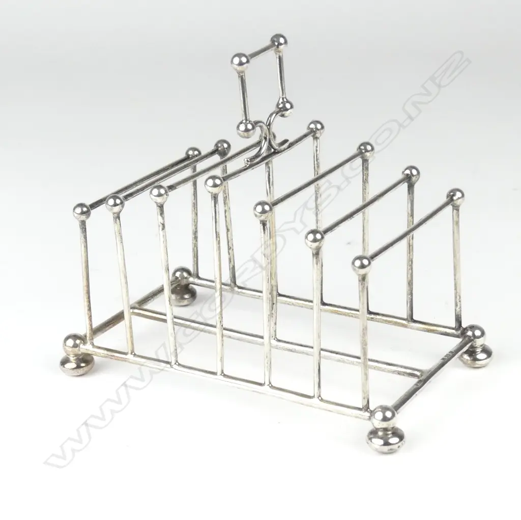 An Edwardian silver toast rack Image 1++