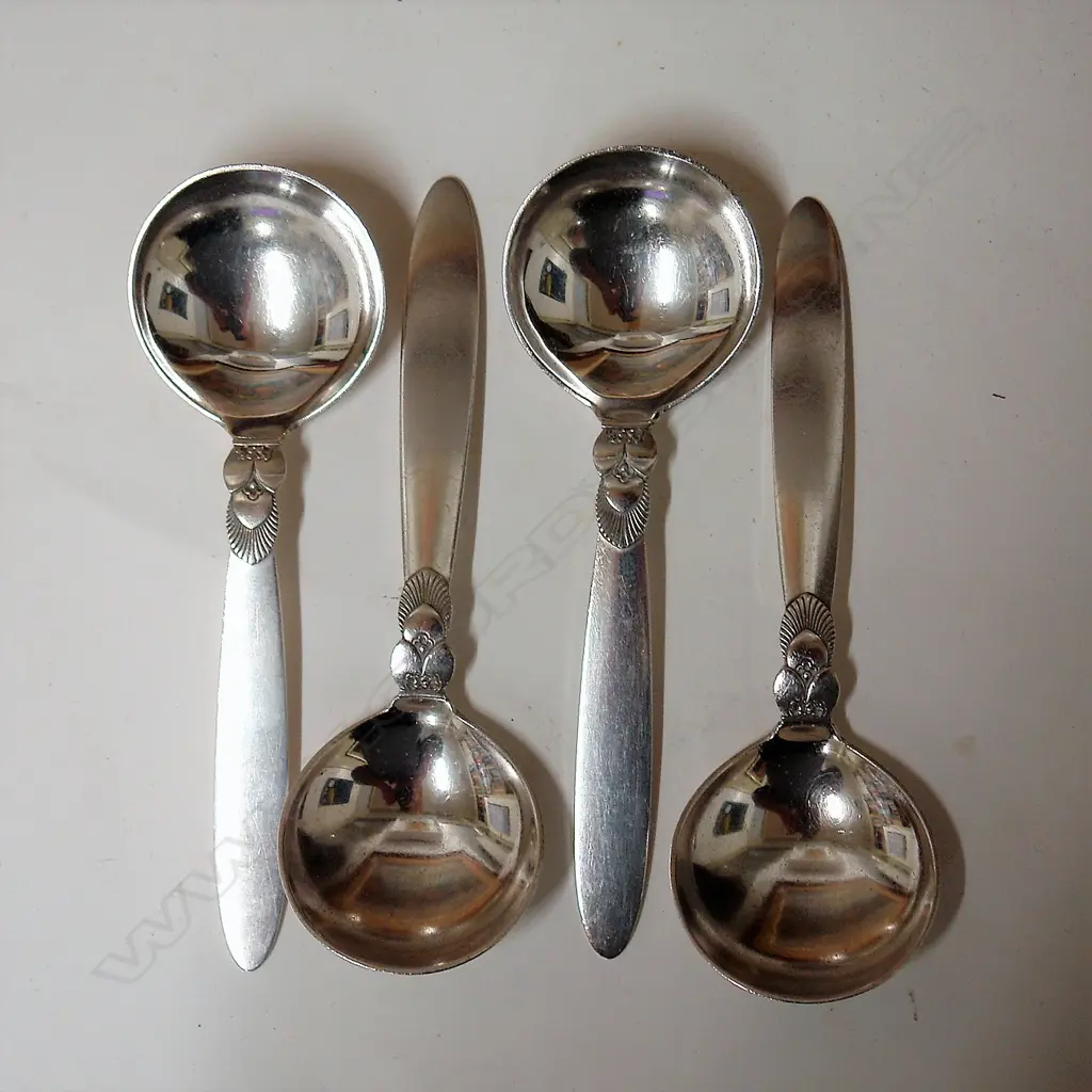 A set of four 20thC Georg Jensen silver cactus pattern serving spoons Image 1++