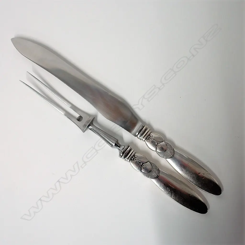 A 20thC Georg Jensen cactus silver handled two-piece carving set Image 1++