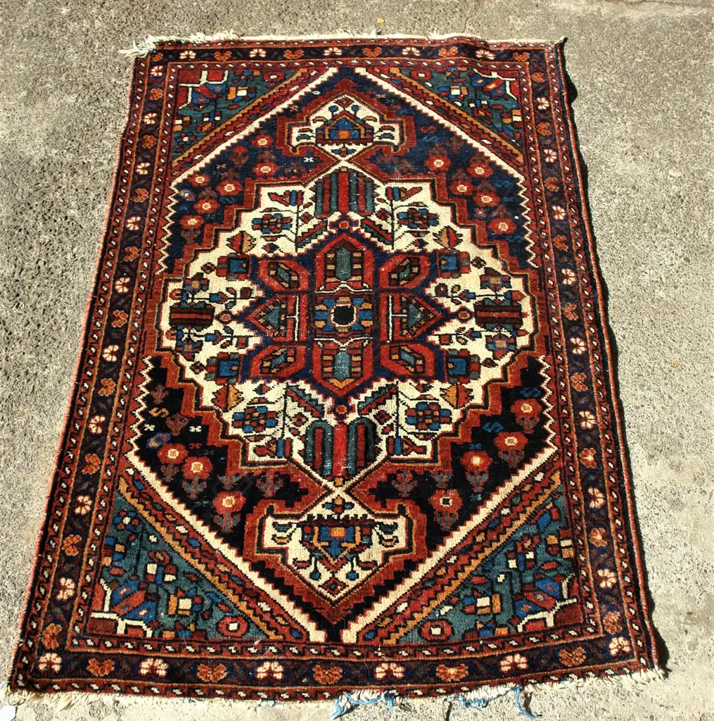 A Persian semi-antique wool on cotton rug Image 1++