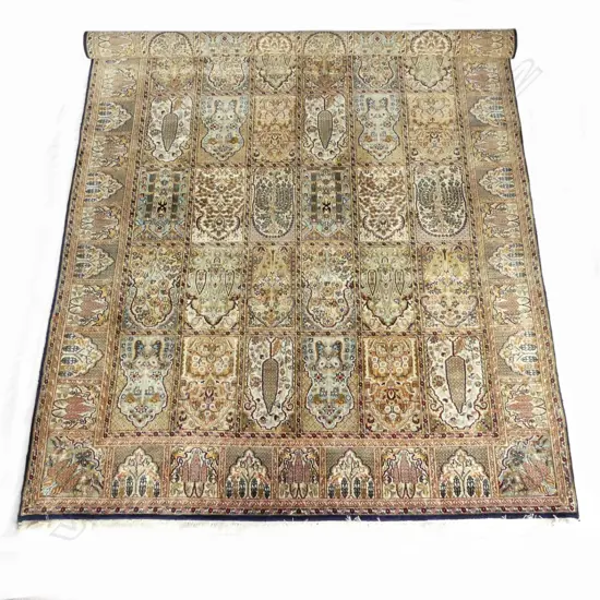 A large silk and wool hand knotted carpet