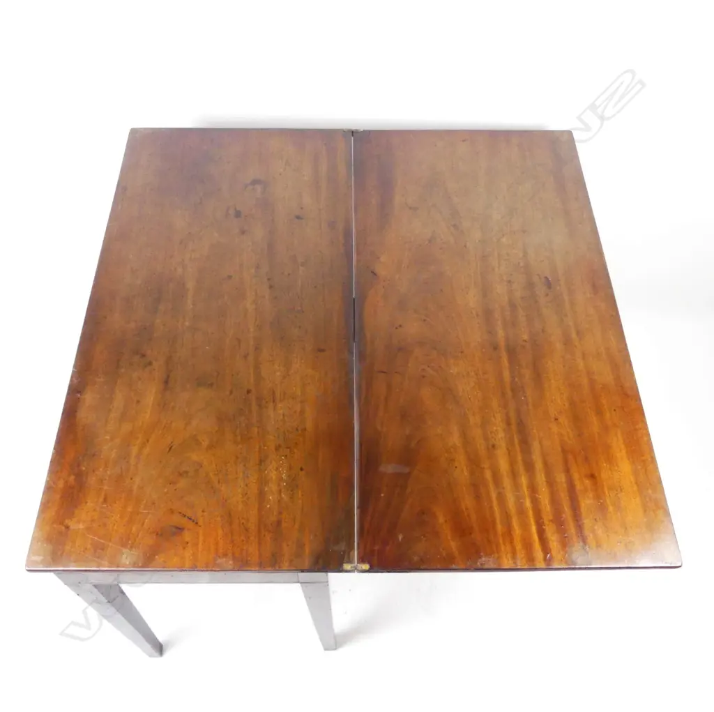 A George III mahogany fold-over tea table Image 1++