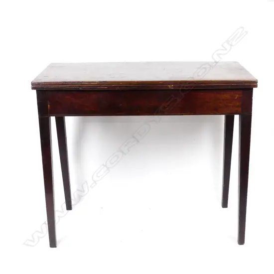 A George III mahogany fold-over tea table