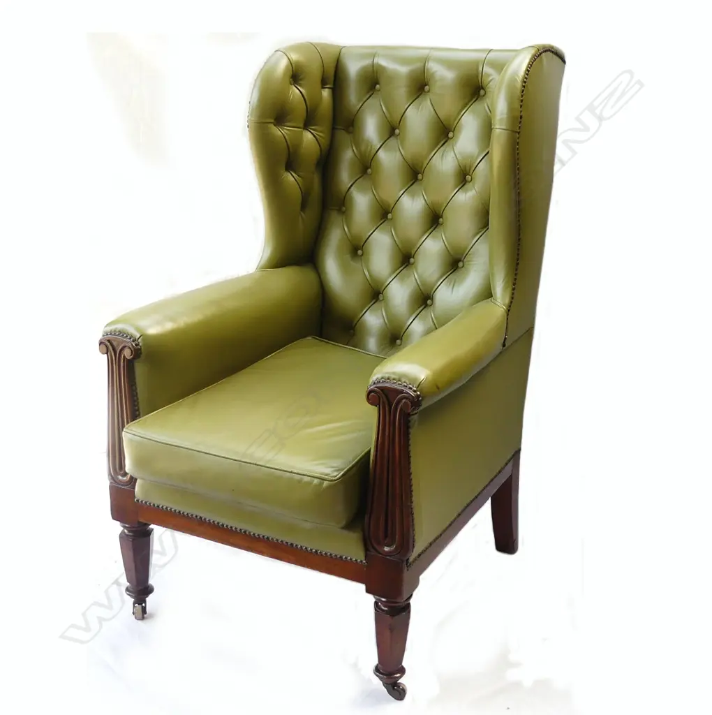 A William IV mahogany and green leather wing back library armchair Image 1++