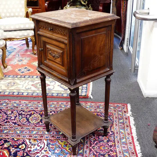 A French walnut marble top bedside cabinet
