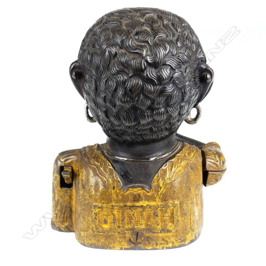 A vintage Dinah cast iron money bank Image 1++