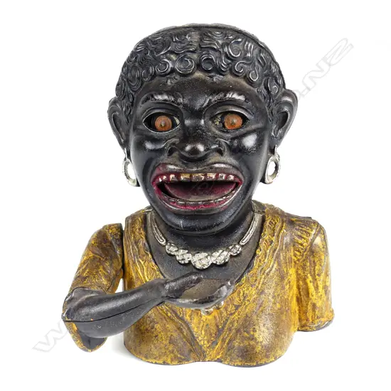 A vintage Dinah cast iron money bank