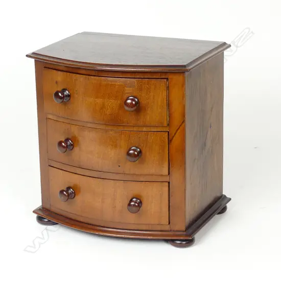 A mahogany small proportion bowfront jewellery chest