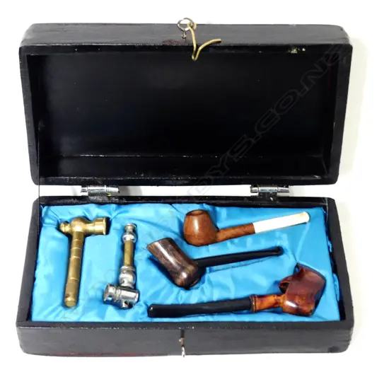 A boxed collection of five pipes
