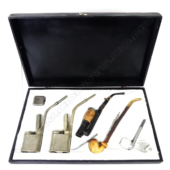 A collection of five pipes and accessories