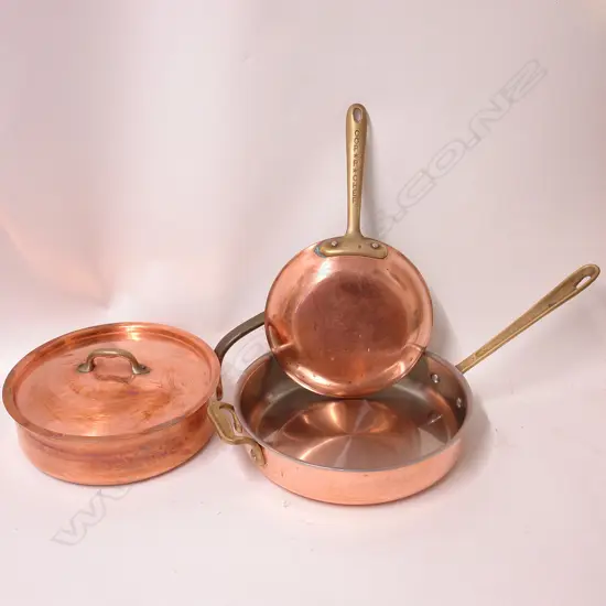 Three quality copper and brass chef's pans