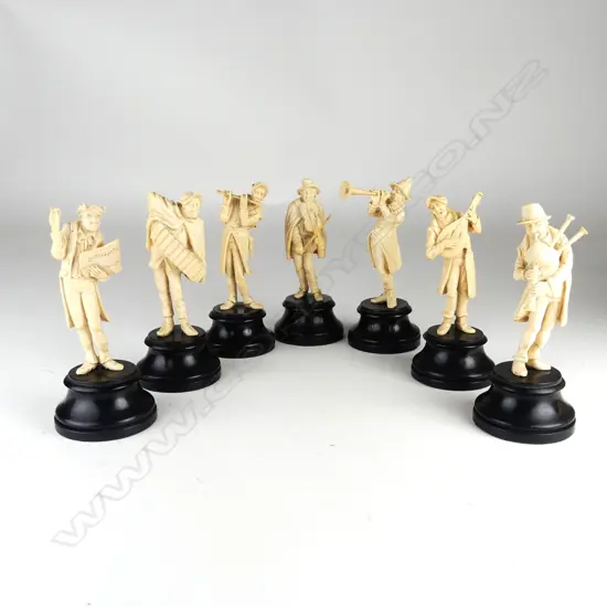 An assembled set of seven carved ivory and fruitwood musicians