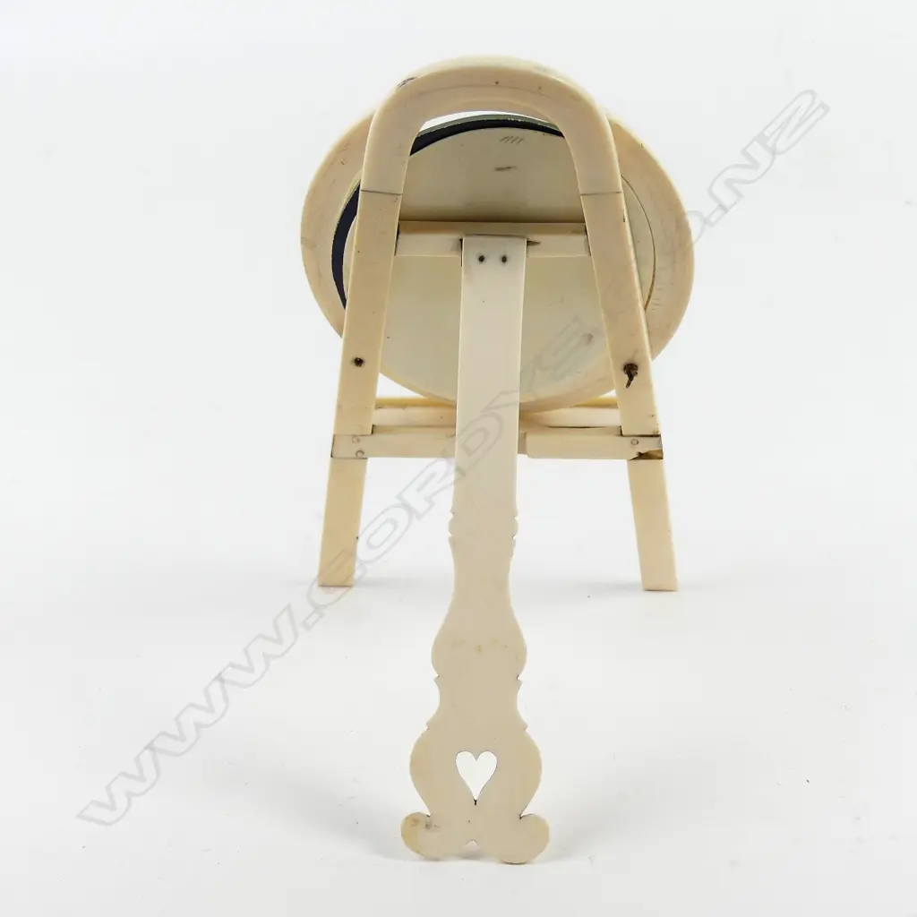 A small vintage ivory mirror Image 1++