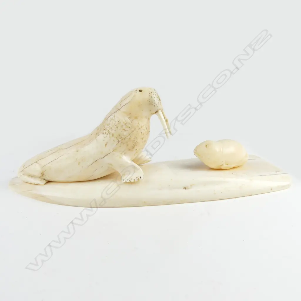 An Inuit marine ivory carving of a walrus and pup Image 1++