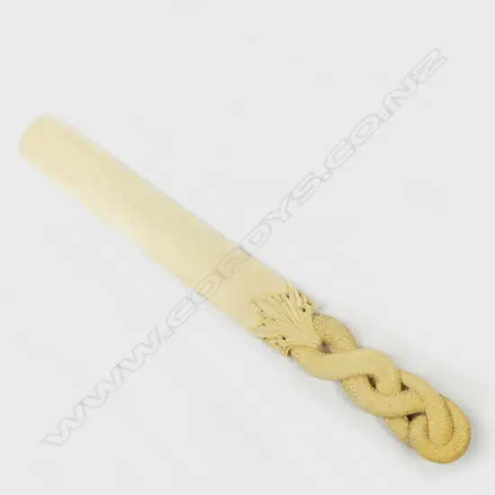 A 19thC finely carved ivory contorted snake paper knife