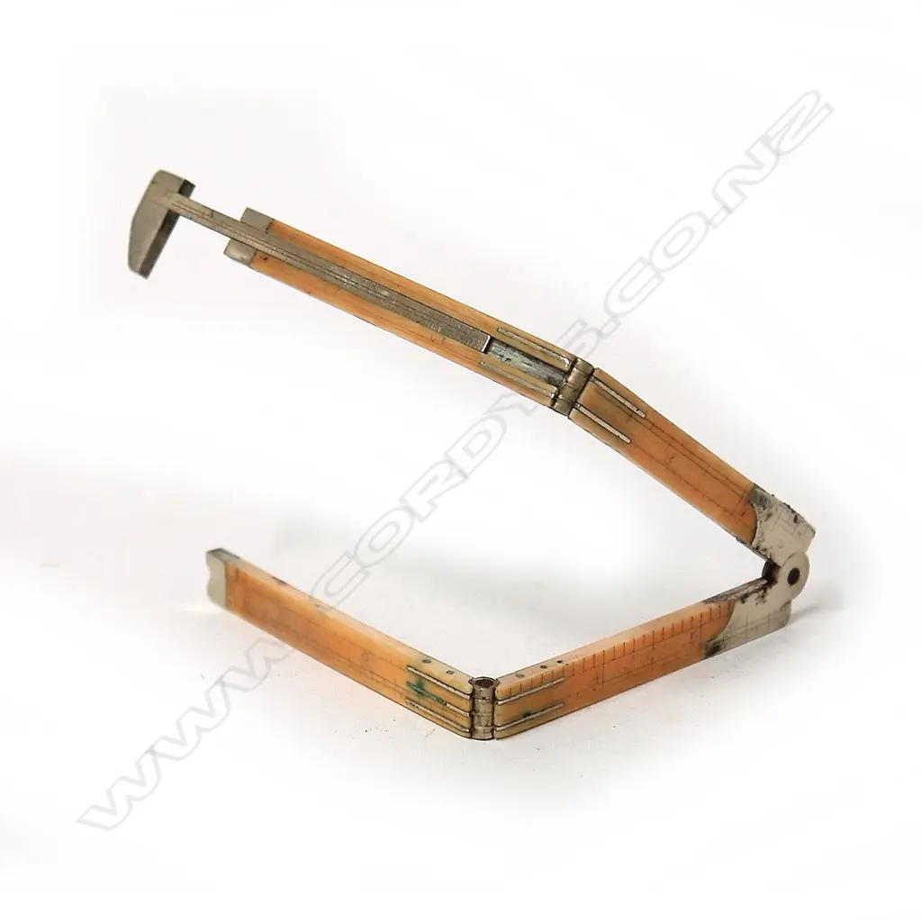 An early 20thC Rabone ivory and white metal four-fold 12” rule Image 1++