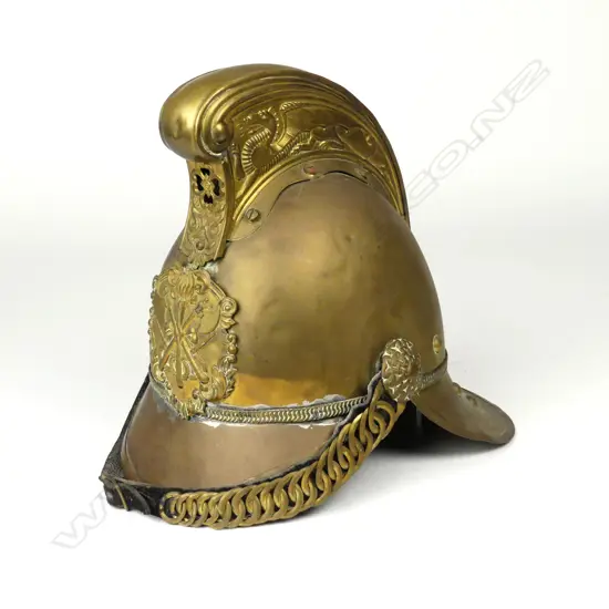 An antique brass Merryweather-type brass fireman's helmet