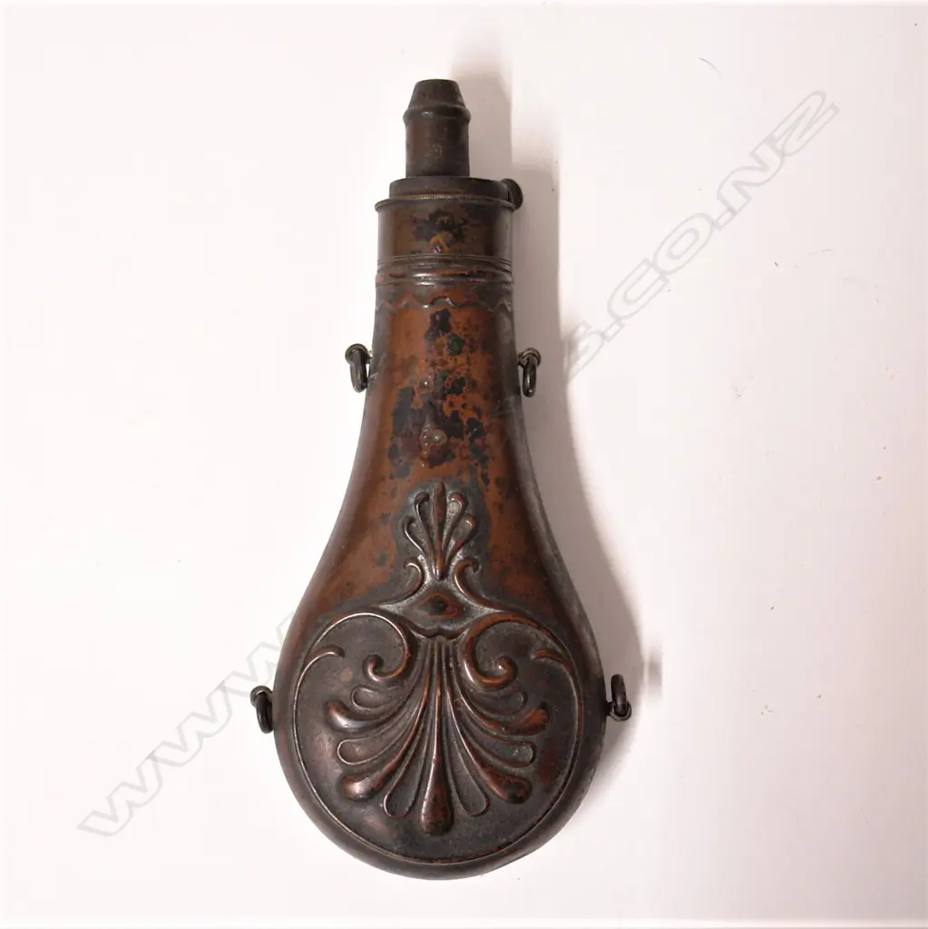 A 19thC copper embossed powder flask Image 1++