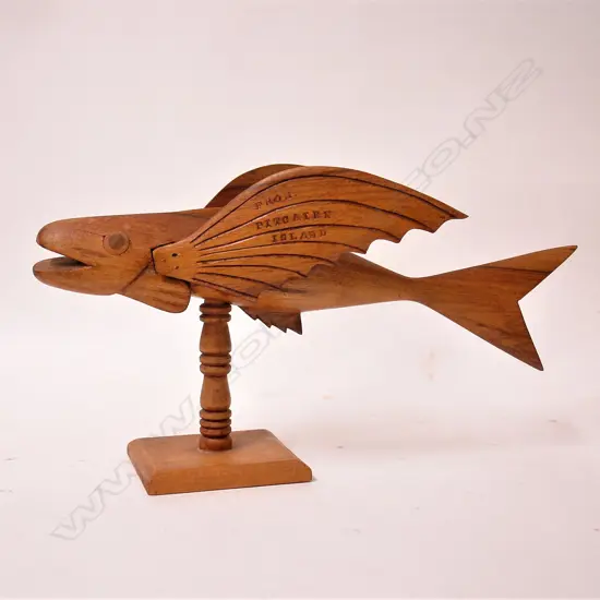 A Pitcairn Island carved wood flying fish on stand