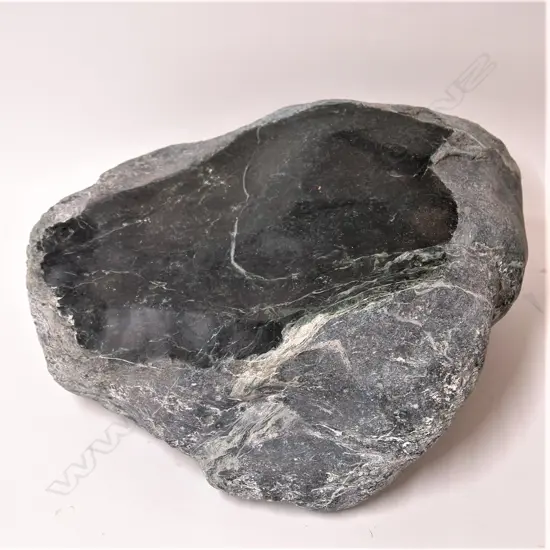 A large pounamu (serpentinite) boulder