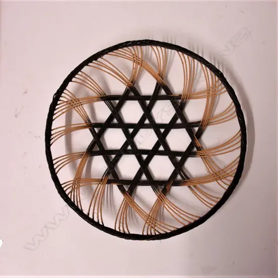 A vintage Ruth Castle hand woven cane dish