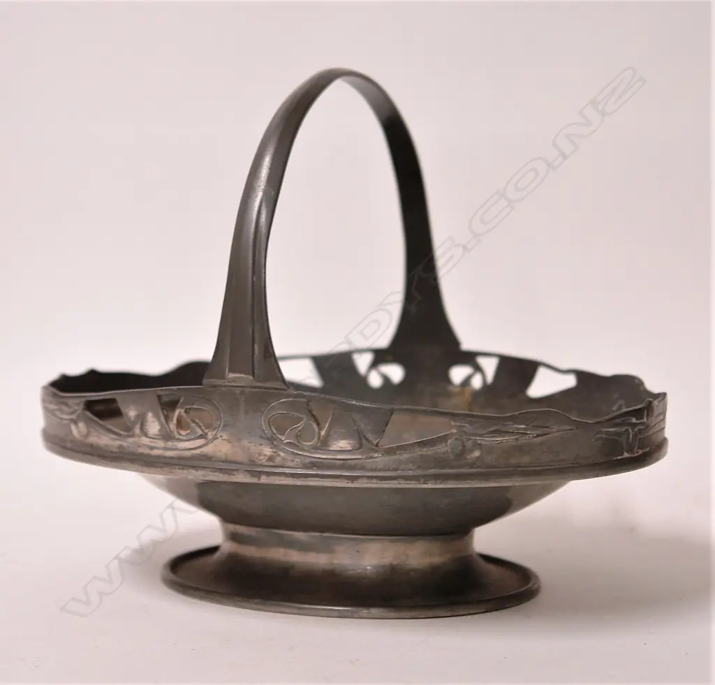 An English Pewter Archibald Knox design footed basket Image 1++
