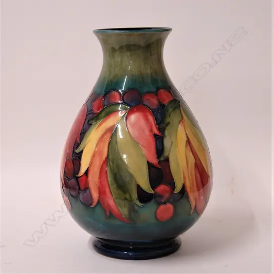 A good William Moorcroft ‘Leaf and Berry’ pattern vase