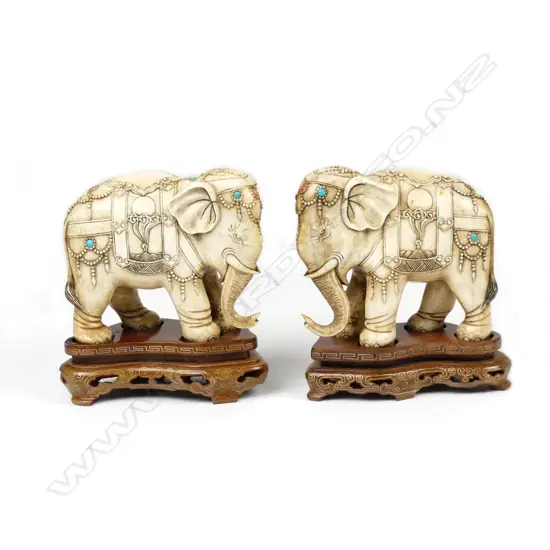 A pair of Chinese carved ivory elephants