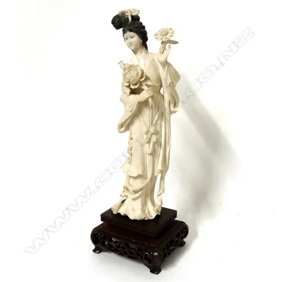 A carved Chinese ivory figure of a young woman