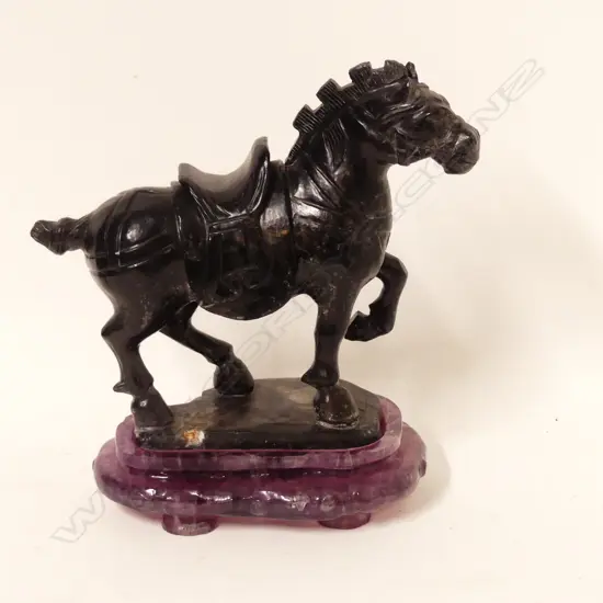 A Chinese carved hardstone horse
