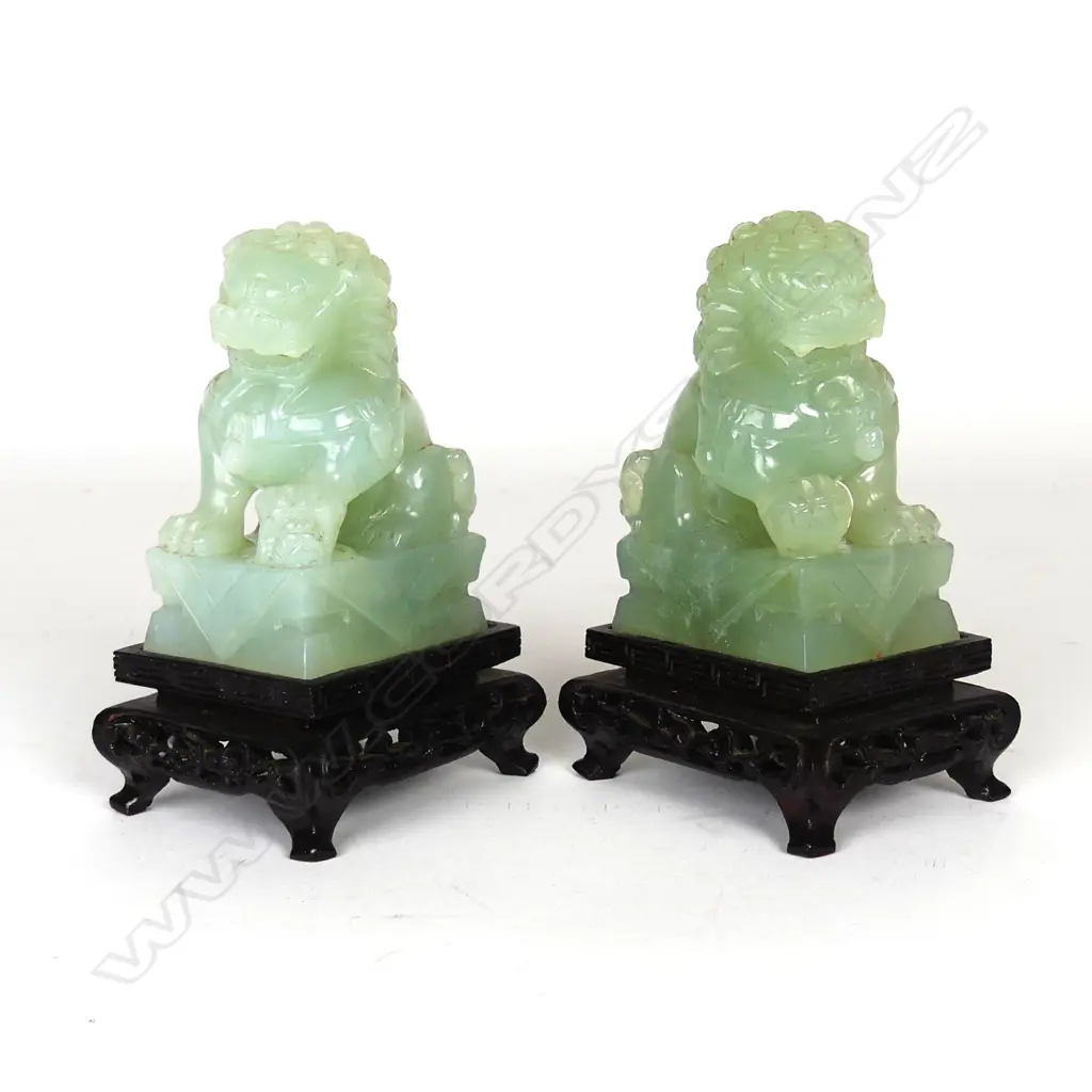 A pair of Chinese carved jade foo dogs Image 1++
